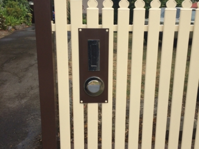 Cream steel picket fence with brown letterbox, posts and bottom rail - Geelong