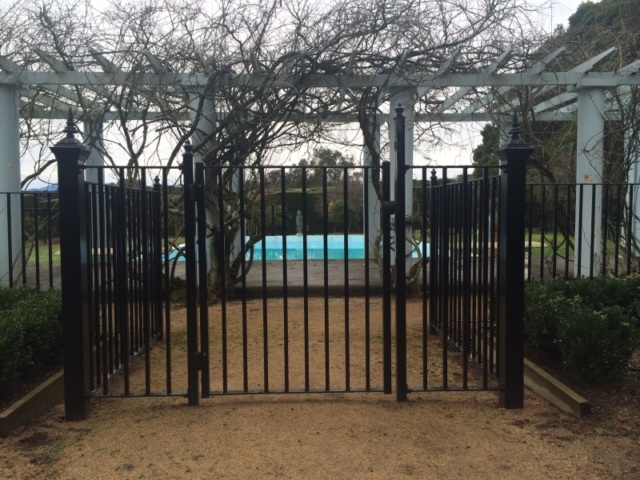Black wrought iron pool fence and pool safety gate Black wrought iron pool fence and pool safety gate