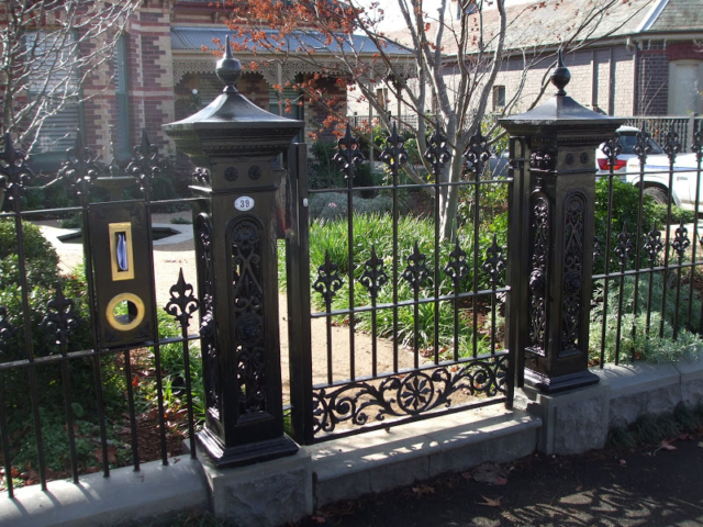 Black wrought iron fence, gate and letterbox Black wrought iron fence, gate and letterbox