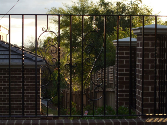 Black wrought iron infill panels Black wrought iron infill panels