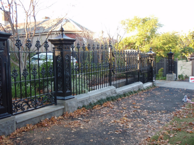 Black wrought iron fence and gate Black wrought iron fence and gate